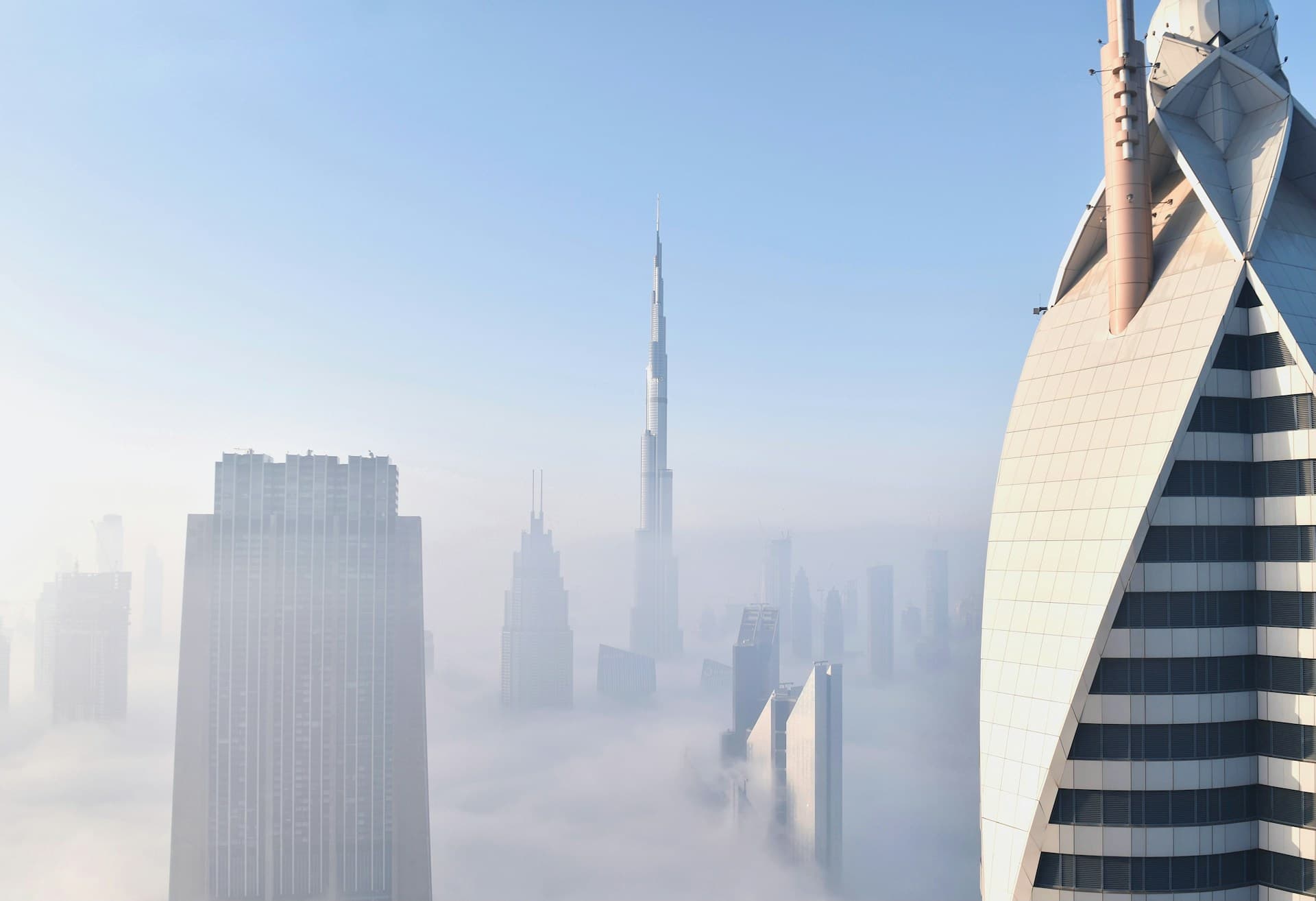 Photo of skyscrapers in Dubai above the clouds